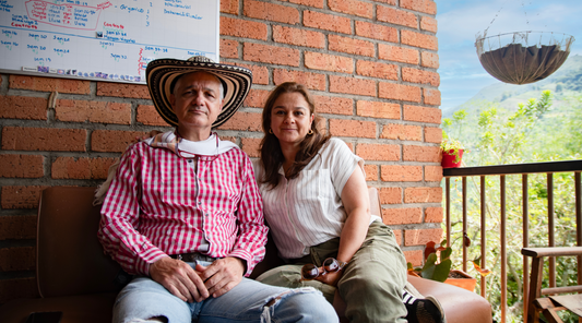 Samuela and Paula sit on the porch of their coffee Finca in Ciudad Bolivar, Colombia